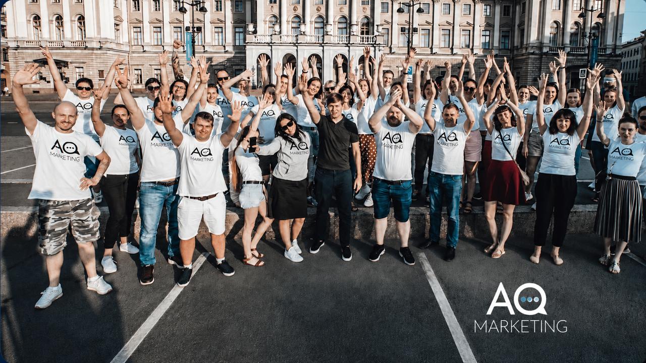 The AQ Marketing team gathered outdoors in branded shirts